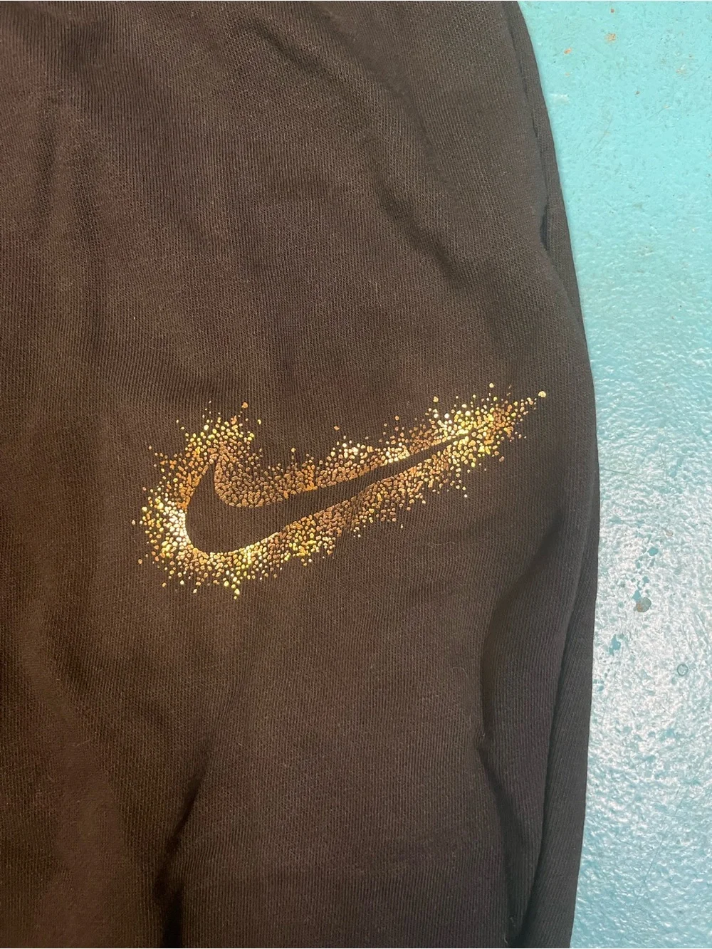 Plus-size Black Nike Sweatpants with gold swoosh